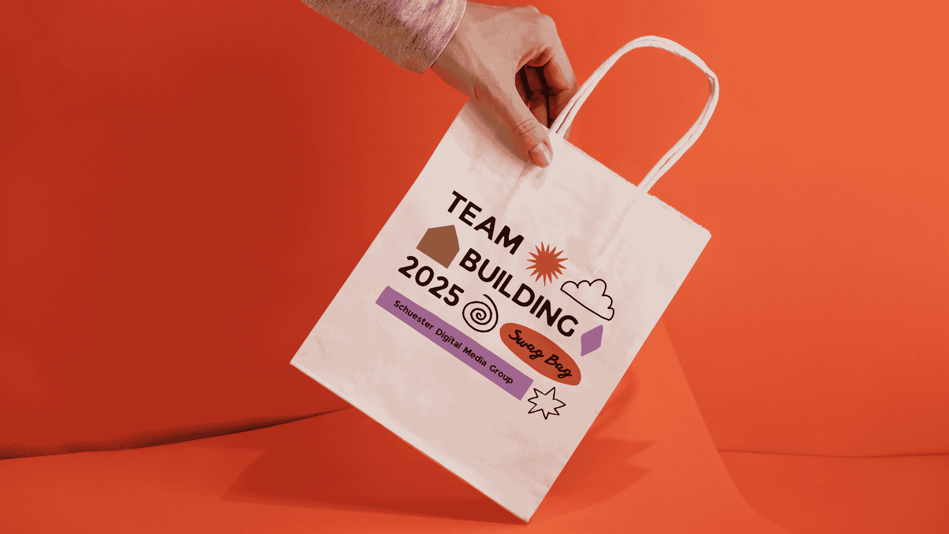 Branded company swag bag showcasing the benefits of company swag stores for team building events, featuring custom company merch and promotional items.