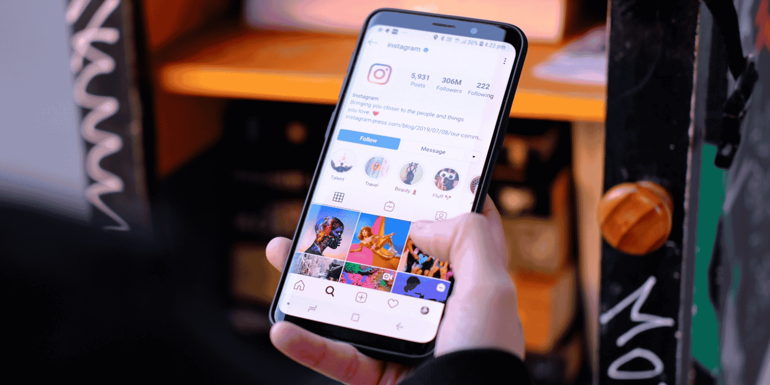 Frustrated person looking at their phone, symbolizing the common feeling of disappointment from not winning Instagram giveaways despite repeated participation.